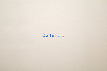 a CALCIUM word stamped on a piece of paper.