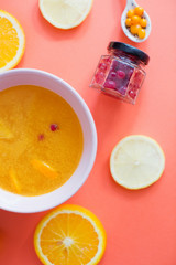Yellow healthy drink with orange and cranberry. Health food and drink to boost immune system