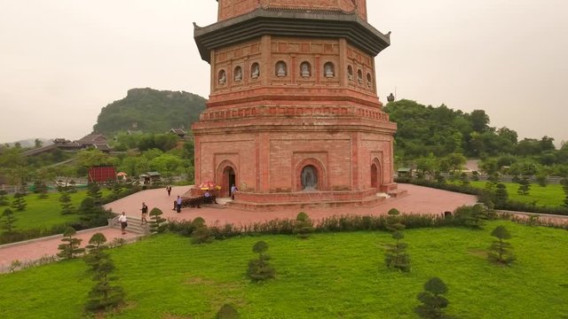 Aerial Circle Ascending Shot of Xa Loi stupa at Bai Dinh Temple Spiritual and Culture Complex in Ninh Binh Vietnam, the largest spiritual tourist place in Vietnam