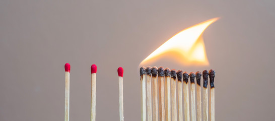 matchsticks burning and gap distance showing preventative containing coronavirus pandemic with copy space for text. Stay at home, Quarantines and Social Distancing concept