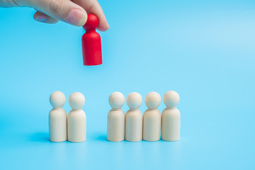 Hand holding wooden man and gap distance showing preventative containing coronavirus pandemic with copy space for text. Stay at home, Quarantines and Social Distancing concept