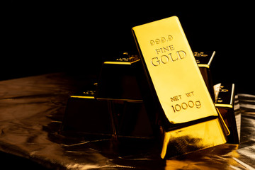 Close up of gold bars on black bacground. financial concept