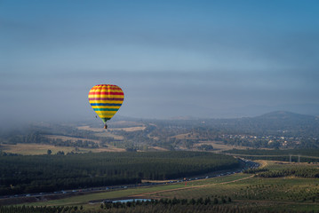 Hot Air Balloon flying high above the countryside in Canberra, Australia