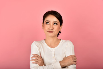 Asian woman feeling upset and frustrated, Girl rolling eyes with boredom and annoy about gossip,...