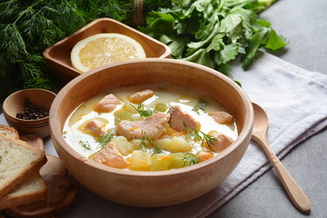 Creamy fish soup with salmon, potatoes, onions , carrots, dill and celery . Kalakeitto-traditional dish of the Finnish cuisine or Russian Ukha Fish Head Soup. Healthy Food Concept. Omega-3