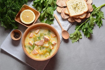 Creamy fish soup with salmon, potatoes, onions , carrots, dill and celery . Kalakeitto-traditional dish of the Finnish cuisine or Russian Ukha Fish Head Soup. Healthy Food Concept. Omega-3
