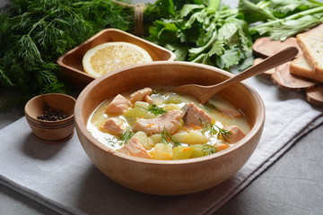 Creamy fish soup with salmon, potatoes, onions , carrots, dill and celery . Kalakeitto-traditional dish of the Finnish cuisine or Russian Ukha Fish Head Soup. Healthy Food Concept. Omega-3