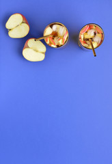 Glasses of tasty cold ice tea on color background