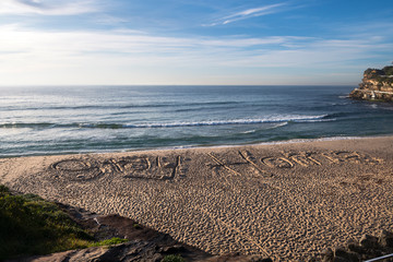 Stay Home sign drawn into the  sand at the closed Bronte Beach,Closed Tamarama Beach, Sydney...
