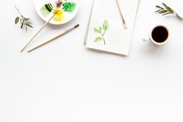 Painting herbs. Brushes and picture on white background top-down copy space