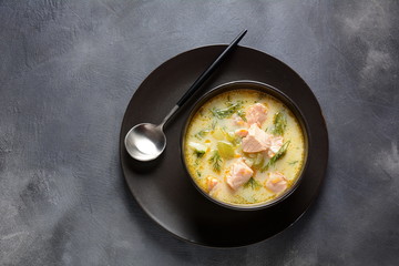 Creamy fish soup with salmon, potatoes, onions , carrots, dill and celery . Kalakeitto-traditional dish of the Finnish cuisine or Russian Ukha Fish Head Soup. Healthy Food Concept. Omega-3