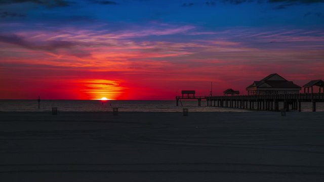 Sunset timelapse 4K Beautiful bright and colorful sky with clouds. Gulf of Mexico. Florida Clearwater Beach. Fishing Pier 60
