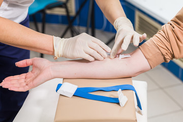 Covid-19, pandemic, coronavirus and viruses concept - Close-up of doctor takes blood on the...