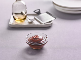 tkemali sauce in a bowl on the background of the kitchen