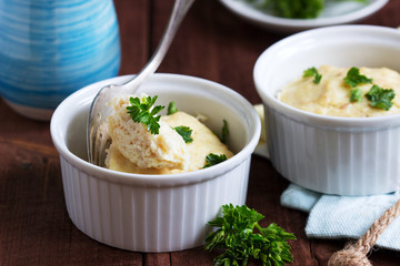 Dietary souffle of minced meat with parsley on a dark background.