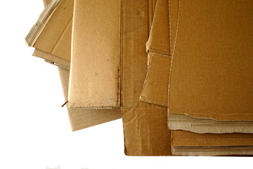 Close-up of stacked corrugated cardboard on white background.