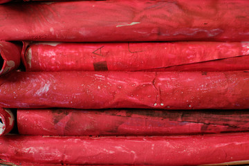 Background of red cardboard in the form of folded log