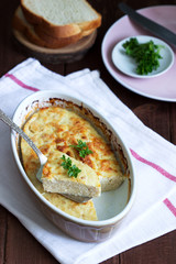 Dietary souffle of minced meat with parsley on a dark background.