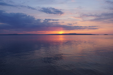 Fototapeta na wymiar Sunset reflection in water