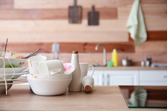 Many Dirty Dishes On Kitchen Table