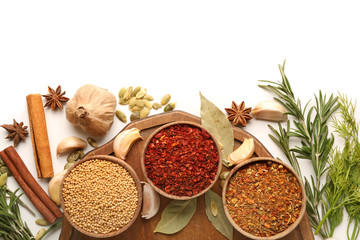 Different spices on white background