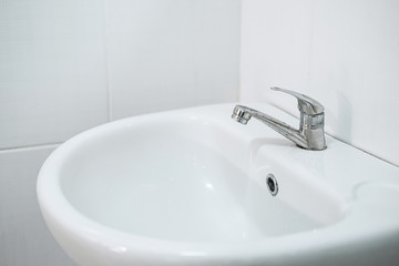 Image of Interior of bathroom with sink and faucet, Modern square sink in the bathroom