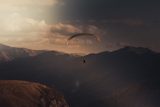 Paragliding over beautiful landscape with Sunset time