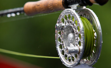 Fragment of a fly fishing rod with dew drops