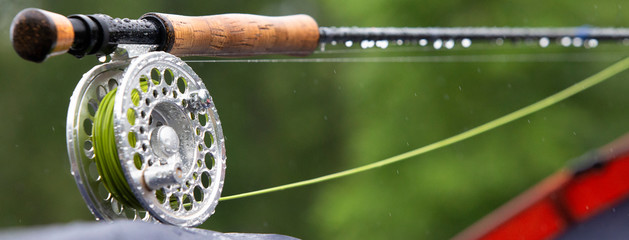 Fragment of a fly fishing rod with dew drops - 336320412