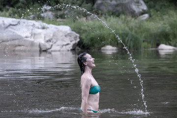 Fototapeta premium Girl throws water head