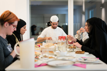 Fototapeta na wymiar Muslim family gathering for having Iftar in Ramadan together