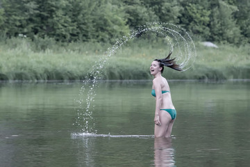 Girl throws water head