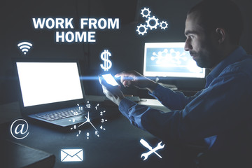 Man holding smartphone. Work from home