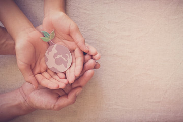 Hands holding growing tree on earth, save planet, earth day, world environment day, ecology...