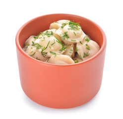 Bowl with tasty dumplings on white background