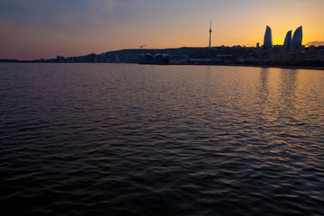 Fototapeta premium Sunset of Baku, Azerbaijan . Fire towers in the night