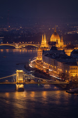 Budapest city at blue hour twilight with illuminated Chain Bridge and Hungarian Parliament on Danube River, tranquil evening cityscape.popular