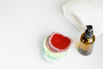 Reusable Pads and bottle of cleanser or toner