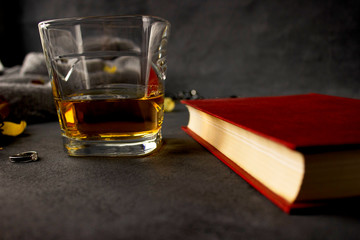 glass of cognac and books