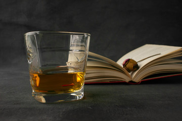 glass of whiskey on black background