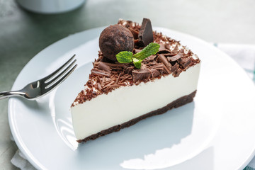 Piece of tasty chocolate cheesecake on plate
