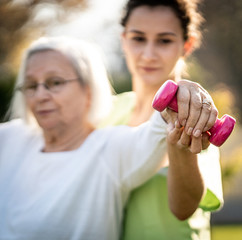 Senior woman doing sport and working out outdoors