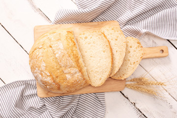 Fresh bread on wooden table. Top view with space for your text