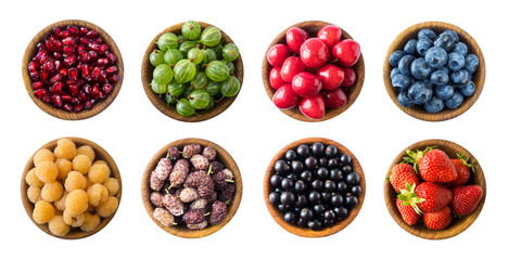 Top view. Fruits and berries in bowl on white background. Fruits with copy space for text. Collage of different fruits and berries isolated on a white background. Fruits and berries isolated on white.