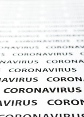Black plain text on white paper about coronavirus outbreak. Coronavirus.