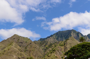 Fototapeta na wymiar Greenish Mountain Range Seen From La Hermigua On La Gomera. April 15, 2019. La Gomera, Santa Cruz de Tenerife Spain Africa. Travel Tourism Photography Nature.
