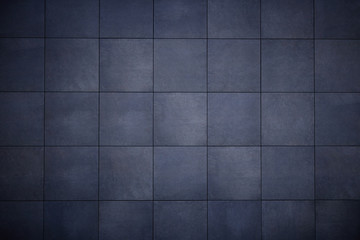 Abstract background from dark gray tiles