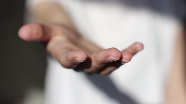 young woman's hand reaching out