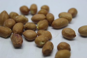 Many peanuts in white background 