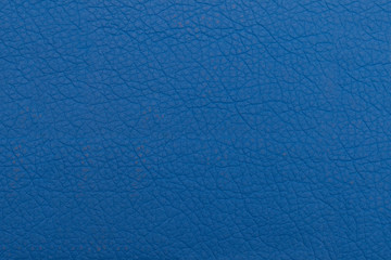 Obraz na płótnie Canvas Blue background of genuine leather. Textural surface with a pattern.